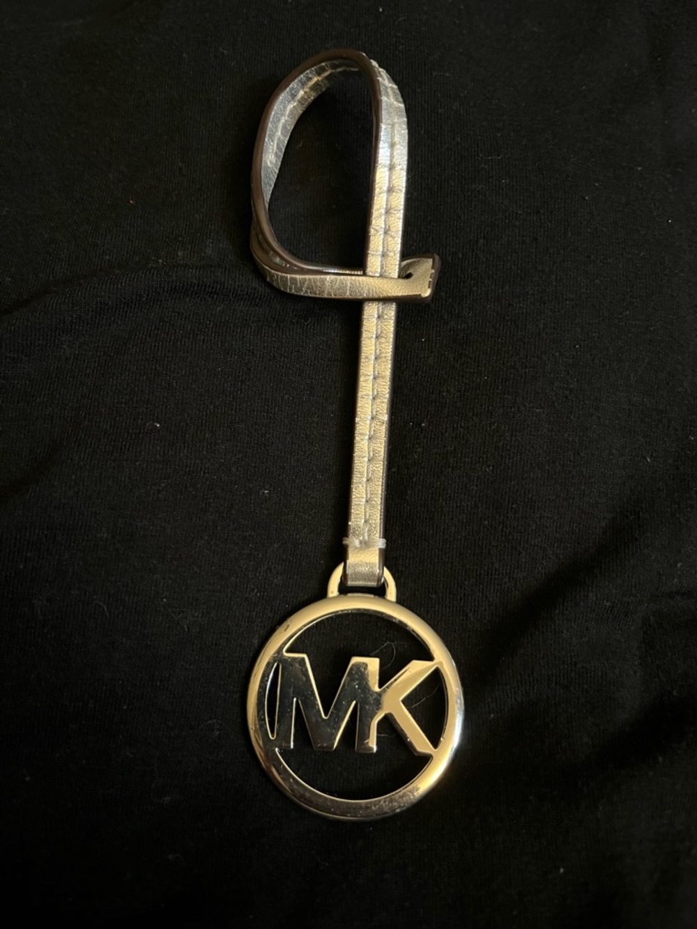 Michael Kors Silver Tone MK Circle Logo Leather Tag with Strap